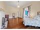 Large bedroom boasts hardwood floors, a fireplace, and two entries to additional rooms at 121 N Congress St, York, SC 29745