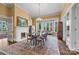 Formal dining room with chandelier lighting, fireplace, and an abundance of natural light at 121 N Congress St, York, SC 29745