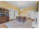Formal dining room with chandelier, hardwood floors and decorative moldings at 121 N Congress St, York, SC 29745