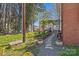 Exterior view of a brick home with a stone pathway and flower garden at 121 N Congress St, York, SC 29745