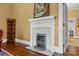 Living room featuring a decorative fireplace, dark hardwood floors and a glass paneled door at 121 N Congress St, York, SC 29745