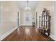Elegant foyer with hardwood floors, a crystal chandelier, and antique furniture creating a grand entrance to the home at 121 N Congress St, York, SC 29745
