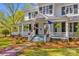 Inviting front porch with classic railings, a cozy seating area, and charming details enhancing the home's curb appeal at 121 N Congress St, York, SC 29745