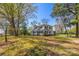 Charming two-story home with a welcoming front porch surrounded by mature trees at 121 N Congress St, York, SC 29745
