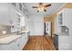 Spacious kitchen with custom cabinetry, granite countertops, and hardwood floors at 121 N Congress St, York, SC 29745