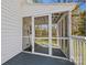 View of screened porch with wooden floors and screen walls at 121 N Congress St, York, SC 29745