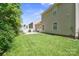 Spacious backyard features a lush lawn, patio, and well-maintained landscaping, perfect for outdoor enjoyment at 1219 Catawba Run Rd, Lowell, NC 28098