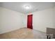 Bedroom with neutral walls and carpet, and a red curtain at 1219 Catawba Run Rd, Lowell, NC 28098