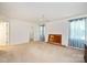 Spacious main bedroom featuring neutral carpet, ceiling fan and ensuite access at 1219 Catawba Run Rd, Lowell, NC 28098