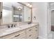 Bathroom with granite countertops, double sinks, bronze fixtures, and a decorative mirror at 13008 Ginovanni Way, Mint Hill, NC 28227