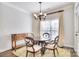 Bright dining area features a chandelier, round table, and a large window with natural light at 13008 Ginovanni Way, Mint Hill, NC 28227