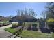 Charming home exterior with well-maintained landscaping, a fenced front yard, and a view of the two-car garage at 13008 Ginovanni Way, Mint Hill, NC 28227