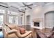 Comfortable living room with stone fireplace, hardwood floors, and ample seating area at 13008 Ginovanni Way, Mint Hill, NC 28227