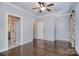 Spacious main bedroom featuring hardwood floors, and ensuite access to the main bathroom at 13008 Ginovanni Way, Mint Hill, NC 28227
