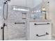 Glass enclosed shower showcasing decorative tile, bronze fixtures, and a decorative window at 13008 Ginovanni Way, Mint Hill, NC 28227