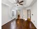 Comfortable main bedroom features dark wood flooring, and access to an en suite bathroom at 1442 Rainforest Ct, Gastonia, NC 28054