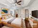 Bright main bedroom features a tray ceiling, modern decor and an en suite bathroom at 1442 Rainforest Ct, Gastonia, NC 28054