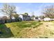 Expansive backyard with mature trees, a playset, and plenty of room to roam at 1448 Morrocroft Trl, Gastonia, NC 28054