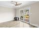 Inviting room with French doors that lead to the yard and a charming ceiling fan at 1448 Morrocroft Trl, Gastonia, NC 28054
