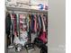 Walk-in closet with ample shelving and hanging space for organized storage at 1448 Morrocroft Trl, Gastonia, NC 28054