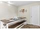 Rustic dining room with a wooden farmhouse table and matching benches, perfect for Gathering gatherings at 1448 Morrocroft Trl, Gastonia, NC 28054