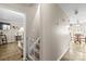 Bright hallway leading to the kitchen and living area, featuring modern decor and lighting at 1448 Morrocroft Trl, Gastonia, NC 28054