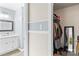View of the bathroom and closet with organized storage at 1448 Morrocroft Trl, Gastonia, NC 28054