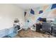A home office space highlighted by a colorful geometric wall and wood floors at 1448 Morrocroft Trl, Gastonia, NC 28054