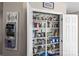 Walk-in pantry offers ample storage with neatly organized shelves filled with various food items at 1448 Morrocroft Trl, Gastonia, NC 28054
