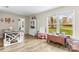 Bright and spacious playroom featuring a large window, wood floors, and plenty of room to play at 1448 Morrocroft Trl, Gastonia, NC 28054