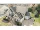Aerial view of a two-story home with a spacious layout, attached garage, and well-kept lawn at 15125 Skypark Dr, Huntersville, NC 28078