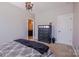 Bedroom with neutral walls, plush carpet, and dark wood dresser and decor at 15125 Skypark Dr, Huntersville, NC 28078
