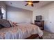 Bedroom showcases a bed, dresser, carpet, and a ceiling fan for added comfort at 15125 Skypark Dr, Huntersville, NC 28078