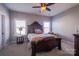 Comfortable bedroom with carpet, a ceiling fan, two windows, and stylish decor at 15125 Skypark Dr, Huntersville, NC 28078