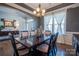Chic dining room with tray ceilings, stylish furniture, and a view into the entryway at 15125 Skypark Dr, Huntersville, NC 28078