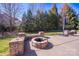 Enjoy the backyard fire pit and stone seating, ideal for cozy evenings outdoors at 15125 Skypark Dr, Huntersville, NC 28078