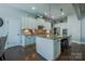 Well-equipped kitchen featuring granite countertops, stainless steel appliances, and a functional island at 15125 Skypark Dr, Huntersville, NC 28078