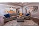 Open-concept living room showcasing a large sectional sofa, neutral decor, and seamless flow to the kitchen at 15125 Skypark Dr, Huntersville, NC 28078