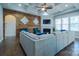 Spacious living room with wood accent wall, coffered ceiling, fireplace, and ample seating at 15125 Skypark Dr, Huntersville, NC 28078