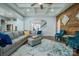 Comfortable living room featuring coffered ceilings, hardwood accent wall, and an open layout at 15125 Skypark Dr, Huntersville, NC 28078
