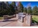 This outdoor kitchen features a stainless steel grill and stone accents, perfect for outdoor entertaining at 15125 Skypark Dr, Huntersville, NC 28078
