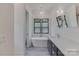 Elegant bathroom with a standalone tub, black vanity, white countertop, and modern finishes at 155 Eagle Chase Ln, Troutman, NC 28166