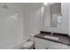 Bathroom featuring white subway tiles and a combination shower-bath at 155 Eagle Chase Ln, Troutman, NC 28166