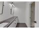 Modern bathroom featuring dual sinks and a subway tile shower at 155 Eagle Chase Ln, Troutman, NC 28166