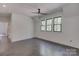 Spacious bedroom with hardwood floors and multiple windows at 155 Eagle Chase Ln, Troutman, NC 28166