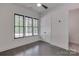 Bedroom featuring hardwood floors, windows, and white trim at 155 Eagle Chase Ln, Troutman, NC 28166