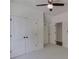 A bright and airy bedroom with a ceiling fan, a large double closet and access to another room at 155 Eagle Chase Ln, Troutman, NC 28166