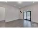 Spacious bonus room with hardwood floors and access to the outdoor covered patio at 155 Eagle Chase Ln, Troutman, NC 28166