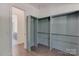 Walk-in closet with rods for ample storage space at 155 Eagle Chase Ln, Troutman, NC 28166