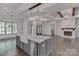 Modern kitchen featuring gray cabinets, a large center island, and plenty of counter space at 155 Eagle Chase Ln, Troutman, NC 28166